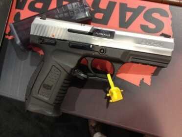 The SAR Arms SAR-40, with the black frame, stainless slide, and chrome barrel.