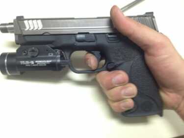 Apex Tactical's S&W M&P Trigger Replacement Finger resting on trigger before pressing