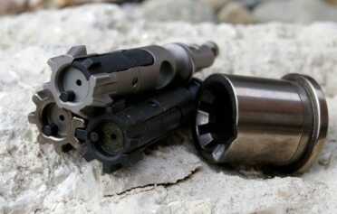 Relia-Bolt (top) with standard phosphate and FailZero Nibo Bolts for comparison. FailZero Barrel Extension shown for reference.