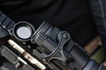 Aimpoint PRO Top view of controls and elevation and windage adjustments