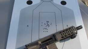 A favored shooting configuration was a Crimson Trace Rail Master laser mounted on the lower rail. Holding the pistol grip and handguard, and bracing the buffer tube on the hip, fast fire groups like this were easy and fun to shoot. 30 rounds went down range way too fast.