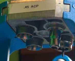 A full set of dies in a Dillon 550B machine, as viewed from below.