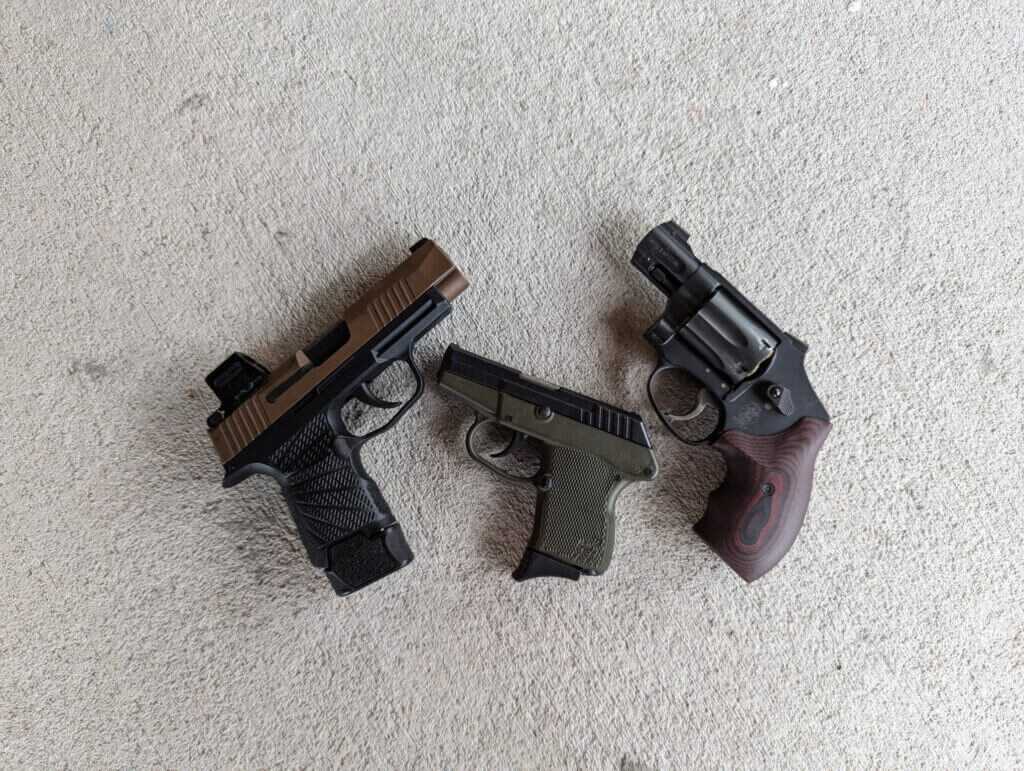 Three very different pistols that make up a carry rotation