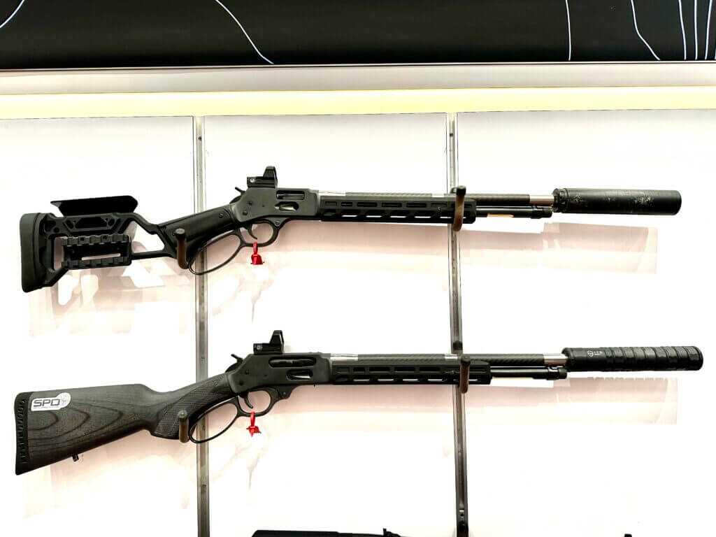 Two rifles are posed on a white background. They point to the right.