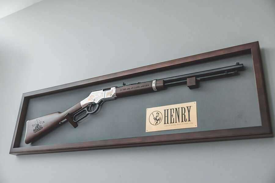 The new Henry rifle displayed on the wall.