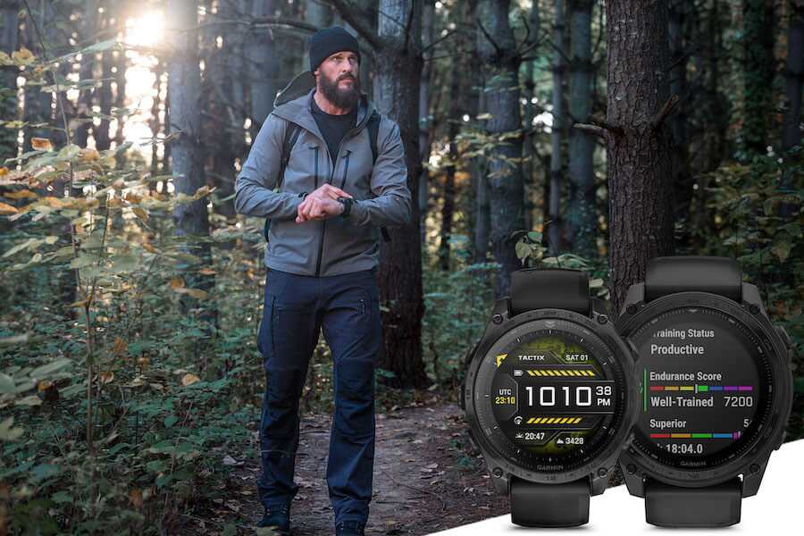 A man walking on a trail wearing the Garmin Tactix 8 watch.
