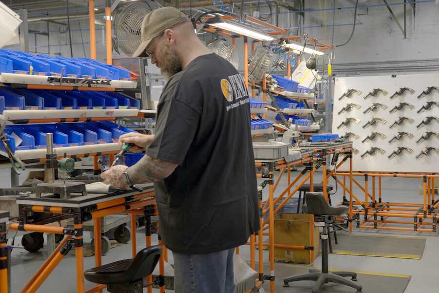 A Henry worker on the assembly line.
