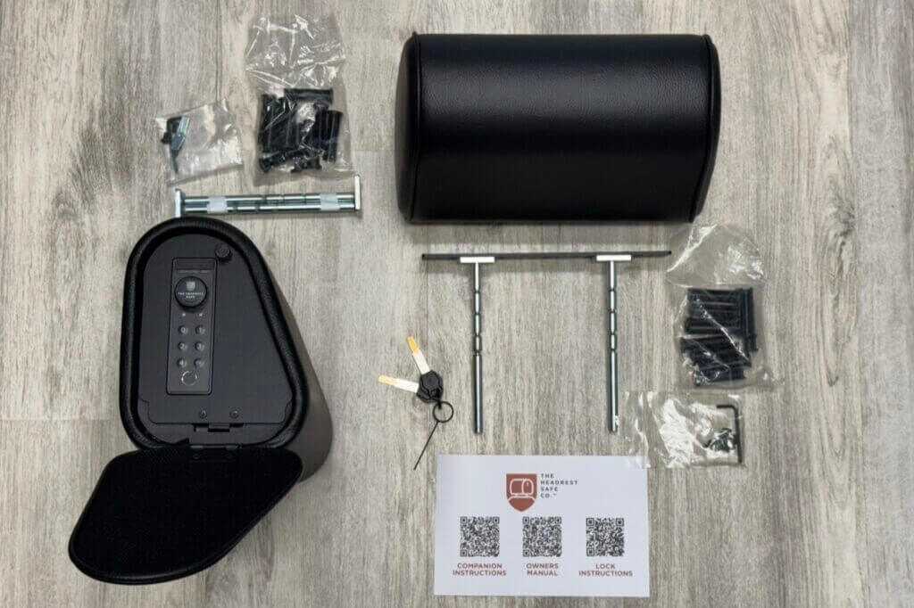 Unboxing the Vulcan Headrest Safe on a light wooden surface