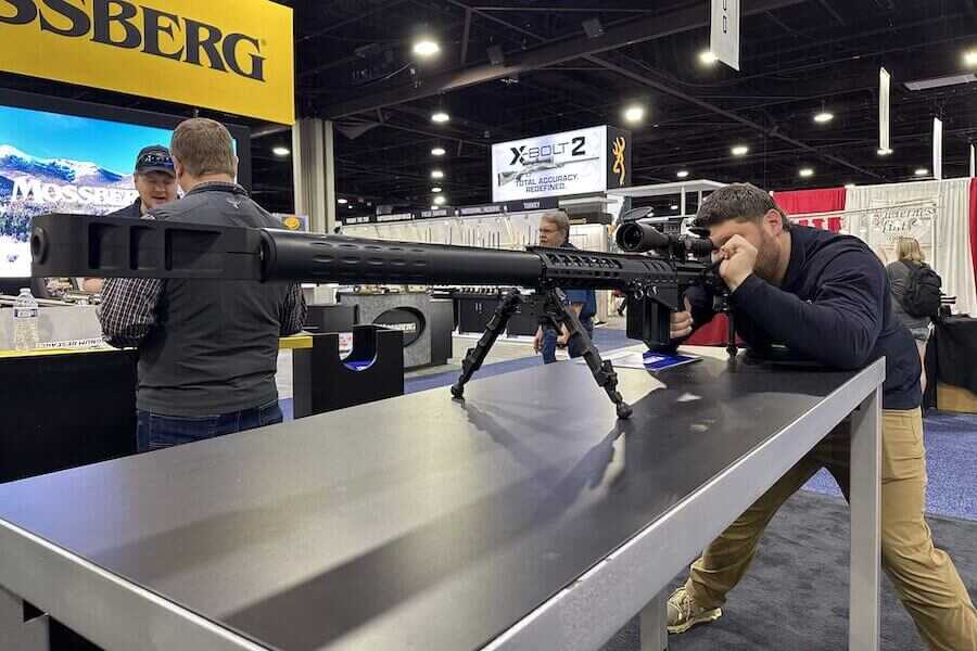50 BMG Rifle with True behind the glass.