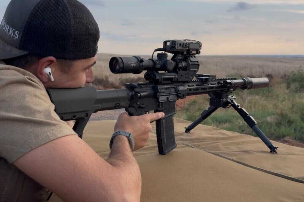 Shooter working a 16 inch 5.56 to 1418 yards using the X4-FCS overlay