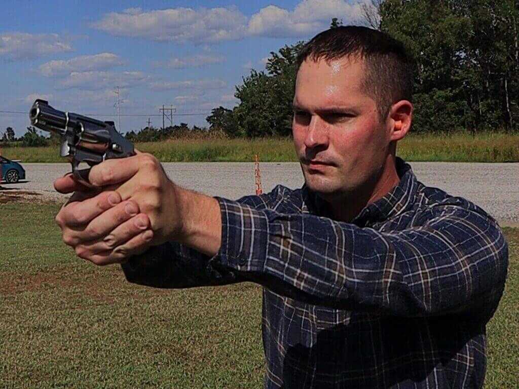 Shooter firing the Smith & Wesson 940 9mm snub nose on the range