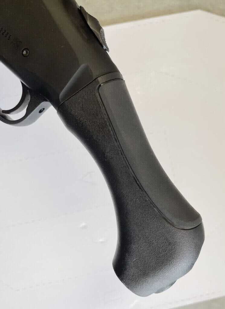 Mossberg 990 Aftershock rubberized palm swell on grip closeup