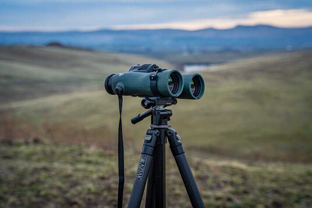 Aziak bino clamp attaching Swarovski NL Pure 12x42 binoculars to Ridge Warden head