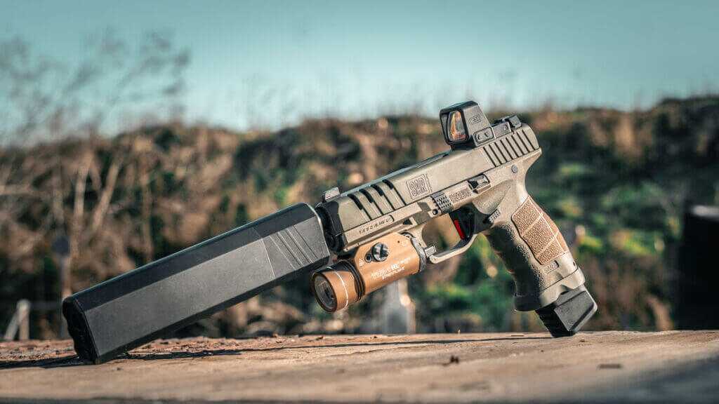 SAR9 SOCOM with suppressor, Streamlight TLR-1 HL, and C&H Precision optic installed