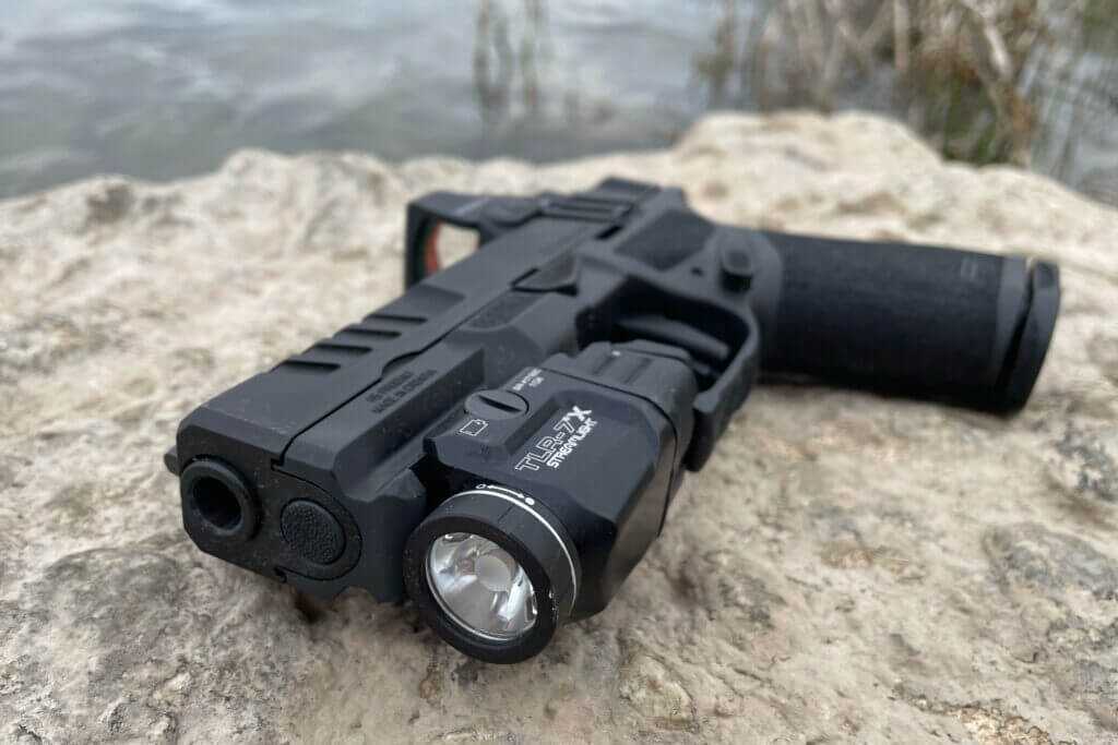 Springfield Echelon 4.0C compact 9mm on river rock showing muzzle and slide profile