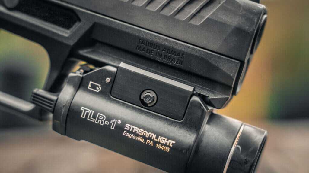 Taurus TX9 with slide locked back showing barrel and recoil system