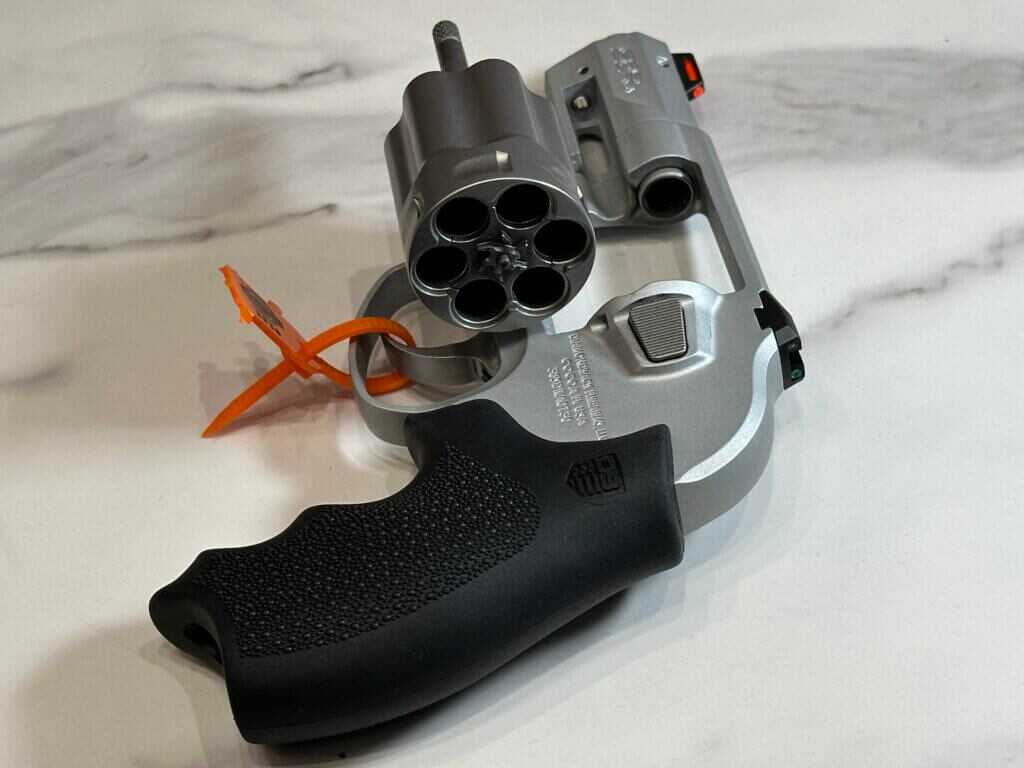 Looking from behind the pistol into the cylinder, which is open for us to see.