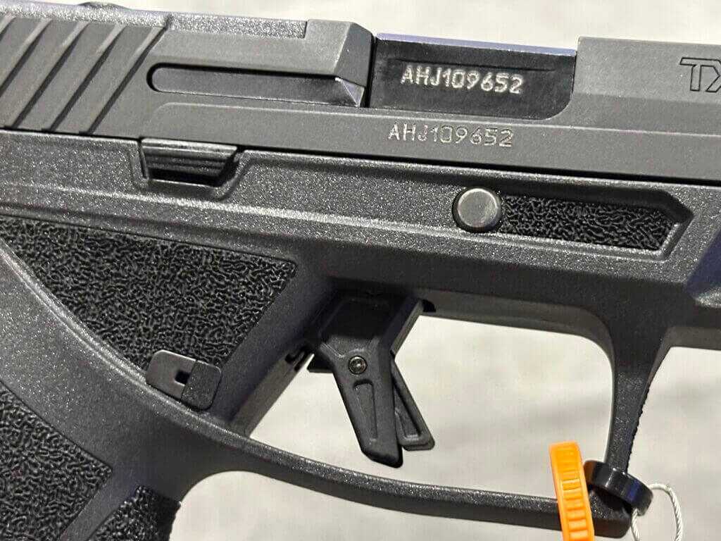 Closeup view of the ejection port side of a semi-auto pistol. 