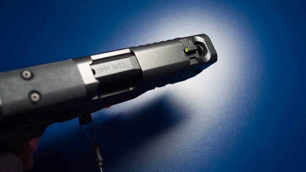 Front top view of the slide showing the front sight and the port.