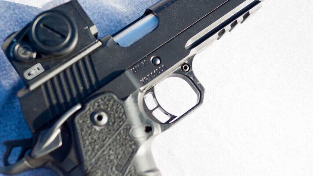 close up view of the right side of the gun focused on the trigger.