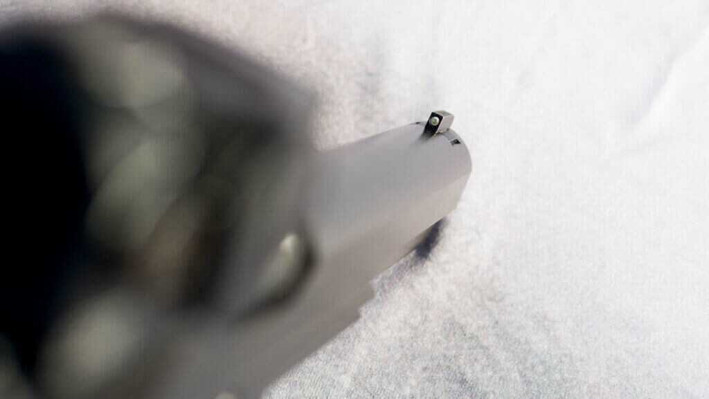 Close up view down the barrel of the night site front site.