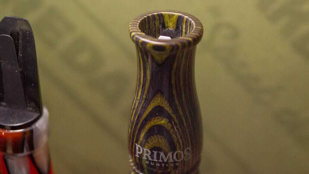 close up view of the mouthpiece of a laminate wood call.