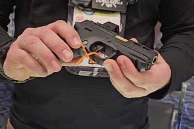 A Bersa BP13 in the hands.