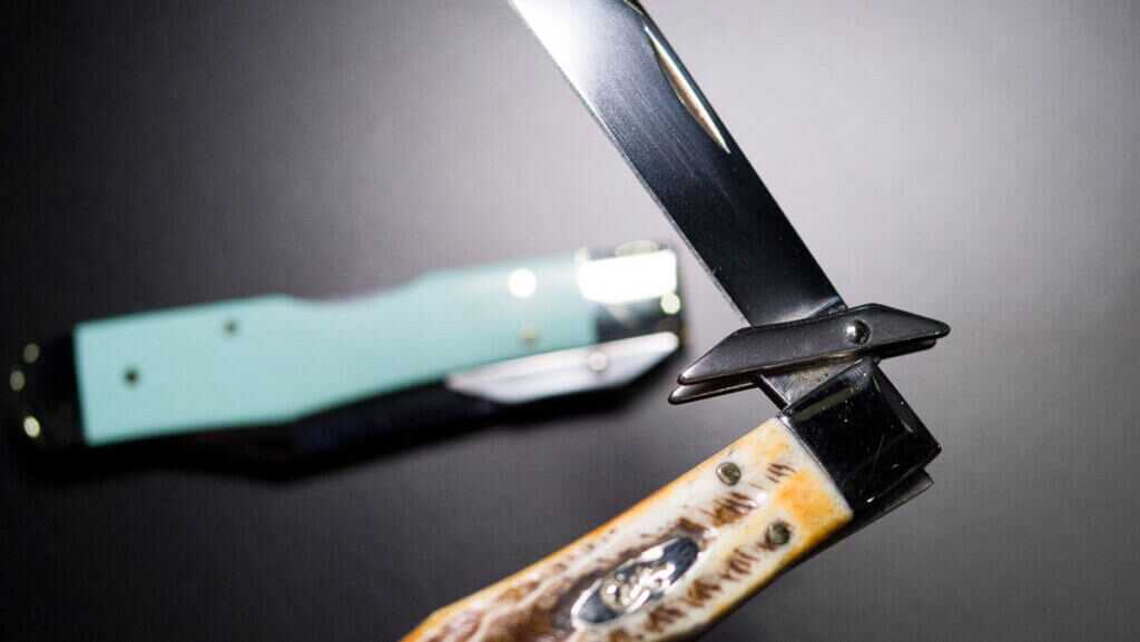 Close up of the guard with another knife behind it on the table.