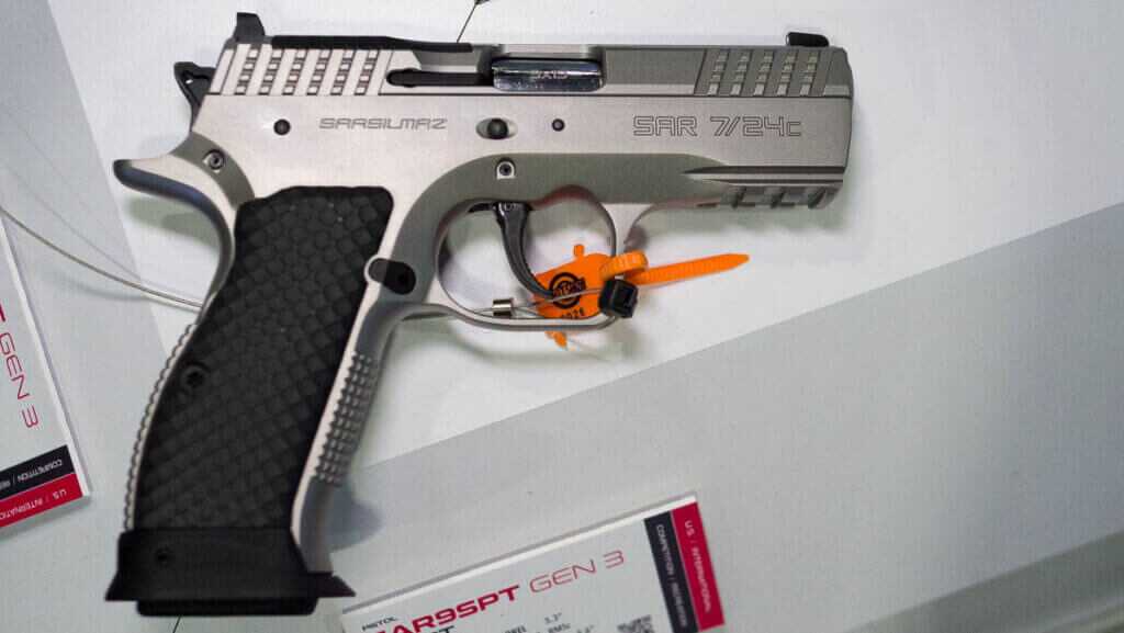 the whole gun in the carry size laying on a table.