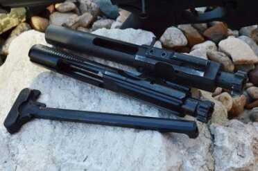 The DPMS GII Recon, a lightweight .308—New Gun Review DPMS GI BCG (Top) versus DPMS GII BCG (Bottom).