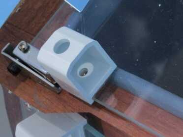 This new version of The Sun Oven comes with two of these centering tools. You turn the oven, raise it and lower it to keep the dot in center of the light showing through. 