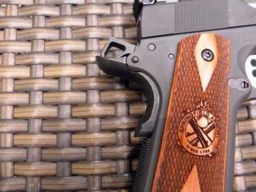 The mainspring housing is deeply checkered and the beavertail safety engages intuitively.