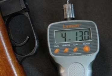 The green scoped rifle's stock trigger was a little lighter, but has over an inch of takeup and drag before breaking. 