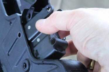 IWI Tavor 5.56/.223 Bullpup Battle Rifle - Solving the Trigger Debacle - Timney Trigger Review The trigger group comes right out.