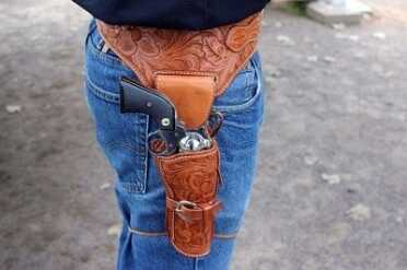 Choosing a Cowboy Action Holster~El Paso Saddlery Right side of the fully carved Hollywood Fast Draw.