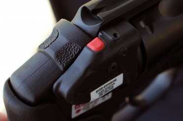 Smith & Wesson M&P .38 Hammerless Revolver w/Crimson Trace The laser control is operated with the thumb. It is easy to operate--but awkward if your finger isn't on the trigger. Still, I like it better than pressure pad on a grip.