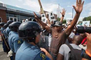 Participants in study were quicker to shoot whites suspects vs. black suspects Protests in Ferguson, Missouri, following the shooting death of 18-year-old Michael Brown. (Photo: Lawyers Weekly)