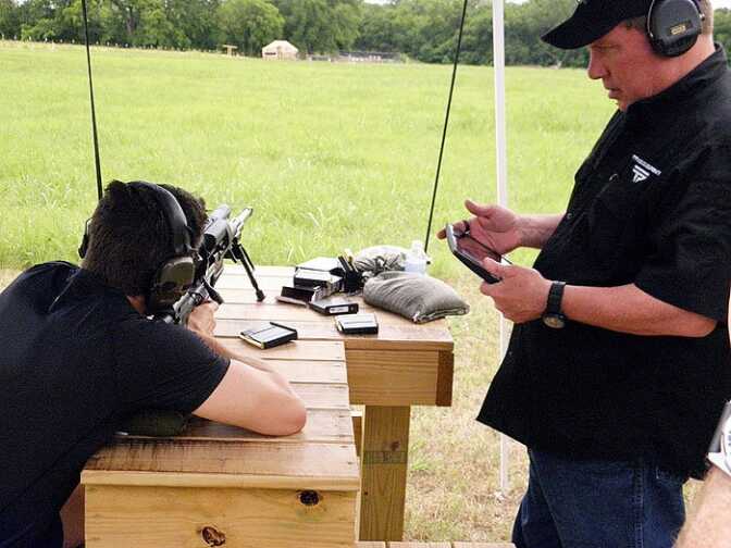 TrackingPoint Review - 70% First Hit Sniper Accuracy at 1,000 Yards! Scott Calvin uses the included iPad to coach a shooter. He can see everything the shooter can see through the scope. In fact, you don’t even have to look through the scope to shoot your target. You can simply use the iPad or your cell phone for your sight picture, allowing you to shoot around corners without exposing yourself to enemy fire. But, ah, that’s another topic.