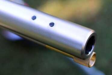 The Ultimate Muzzleloader is a Remington? If you want irons on the UML, adding them should be easy.