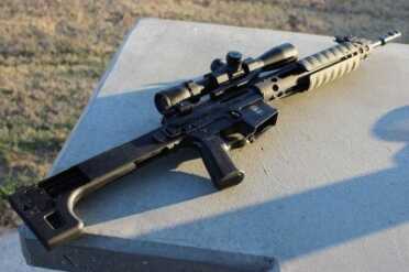 The stock is solid, and heavier than most plastic stocks, but the length of the barrel still puts the balance point right at the front edge of the mag well.