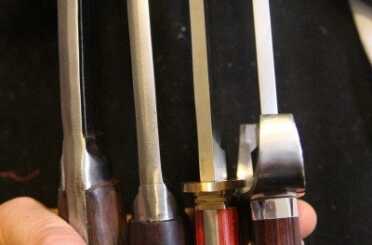 The Kukri has no handguard, but the blade is so thick that it almost feels like a very controllable hatchet. Few Bowie's have that kind of heft. 