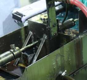 Then the barrels go to the rifling machines. These are some of the machines designed and made by Taurus. There was one for the .22/.25 and one for the .380 set up for our visit. It basically draws a rod through the barrel and the rod has the cutters for the rifling. 