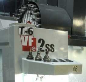 The CNC bits that are used to complete the Model 22 revolve into place on the robot CNC machine. 