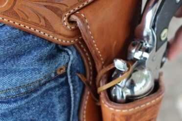 Choosing a Cowboy Action Holster~El Paso Saddlery Loop over the hammer for extra retention.
