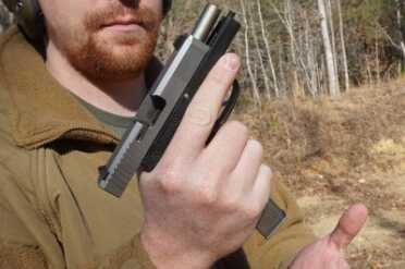 Kahr CT380--The Perfect Pocket Pistol? The grip is long enough that the mag won't catch on your palm when you hit the button.