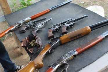 Some of the guns laid out at the practice session at Old Fort Gun Club in Fort Smith, Ar. 