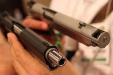 Coonan's Kicking Compact .357--SHOT Show 2015 One with a muzzle brake. The other looks like it wanted to be threaded.