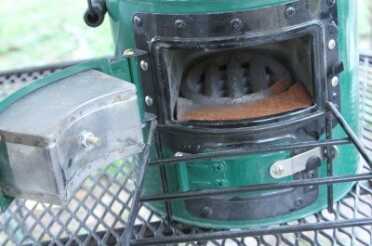 This is the oven before I used it. Note the rust because I had left it outside for about a month before testing it, and also note the extra grate they give you for charcoal, which is my next adventure with the StoveTec.