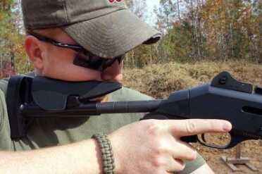 The cheek piece on the ProMag is low enough for the use of the iron sights.