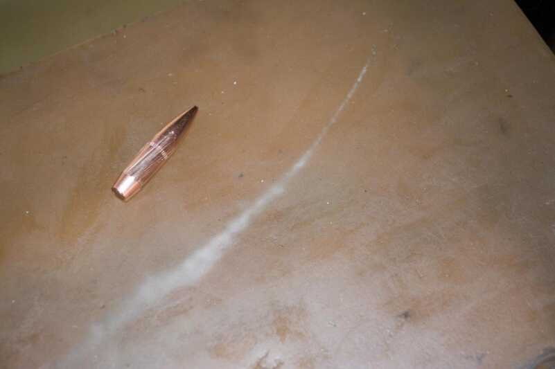 Once that big heavy projectile turned around backwards, it launched off in a wide arc, exiting the side of the gel block.